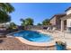 Backyard swimming pool with lounge chairs and desert landscaping at 4771 E Meadow Land Dr, San Tan Valley, AZ 85140