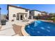 Backyard pool and patio with lounge chairs and desert landscaping at 4771 E Meadow Land Dr, San Tan Valley, AZ 85140
