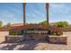 The Castlegate community is welcomed by a brick entrance sign and manicured landscaping at 4771 E Meadow Land Dr, San Tan Valley, AZ 85140