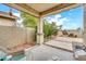 Private back patio surrounded by desert landscaping and a privacy wall is the perfect place to enjoy the outdoors at 660 W Twin Peaks Pkwy, San Tan Valley, AZ 85143