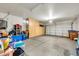 Spacious garage with built-in cabinets for ample storage and a large door for easy vehicle access at 660 W Twin Peaks Pkwy, San Tan Valley, AZ 85143