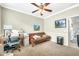 Office space featuring a futon couch, ceiling fan and neutral carpet at 660 W Twin Peaks Pkwy, San Tan Valley, AZ 85143