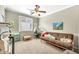 Office space featuring a futon couch, ceiling fan and neutral carpet at 660 W Twin Peaks Pkwy, San Tan Valley, AZ 85143