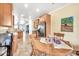 Eat-in kitchen with stainless steel appliances, warm wood cabinets, and a round dining table at 660 W Twin Peaks Pkwy, San Tan Valley, AZ 85143