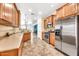 Well-equipped kitchen featuring stainless steel appliances and light wood cabinets at 660 W Twin Peaks Pkwy, San Tan Valley, AZ 85143