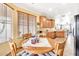 Cozy breakfast nook with a round wooden table and views into the open kitchen area at 660 W Twin Peaks Pkwy, San Tan Valley, AZ 85143