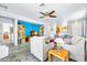 Open-concept living room with a ceiling fan, hardwood floors, and access to the kitchen at 660 W Twin Peaks Pkwy, San Tan Valley, AZ 85143