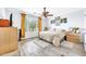 Bedroom featuring wood floors, a ceiling fan, and sunny window at 660 W Twin Peaks Pkwy, San Tan Valley, AZ 85143