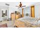 Bedroom featuring wood floors, a ceiling fan, and sunny window at 660 W Twin Peaks Pkwy, San Tan Valley, AZ 85143