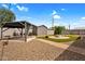 A backyard featuring artificial grass, a brick paver border and gravel at 701 S 92Nd St, Mesa, AZ 85208