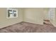 Bright, carpeted bedroom with a large window, providing ample natural light and a cozy, private retreat at 701 S 92Nd St, Mesa, AZ 85208