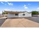 Charming single-story home with a covered parking area, fresh light blue paint, and desert landscaping at 701 S 92Nd St, Mesa, AZ 85208