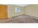 Neutral living room with front door, patterned vinyl transition, and window at 701 S 92Nd St, Mesa, AZ 85208