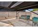 This relaxing covered patio features gravel, a bench and concrete at 701 S 92Nd St, Mesa, AZ 85208
