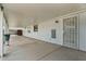 This long covered patio has an enclosed wall at the end at 701 S 92Nd St, Mesa, AZ 85208