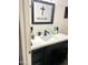 Clean bathroom featuring a modern vanity with black hardware, a sink, and a large mirror at 7013 W North Ln, Peoria, AZ 85345