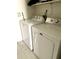Functional laundry area featuring a white washer and dryer for convenient chores at 7013 W North Ln, Peoria, AZ 85345