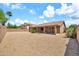 Large, private backyard features desert landscaping, block wall, and a covered patio at 7214 W Crest Ln, Glendale, AZ 85310