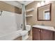 Traditional bathroom with a combined tub and shower, a dark wood vanity, and stylish lighting at 7214 W Crest Ln, Glendale, AZ 85310