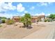 Charming home featuring desert landscaping and a tile roof at 7214 W Crest Ln, Glendale, AZ 85310
