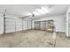 Two-car garage provides ample storage space with metal storage racks along the back wall at 7214 W Crest Ln, Glendale, AZ 85310