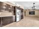 Bright kitchen boasts stainless steel appliances, dark cabinets, and granite countertops at 7214 W Crest Ln, Glendale, AZ 85310