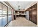 Bright kitchen boasts stainless appliances, dark cabinets, tile floors, and sliding glass doors at 7214 W Crest Ln, Glendale, AZ 85310