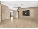 Spacious living room with tile floors and an adjacent entryway at 7214 W Crest Ln, Glendale, AZ 85310