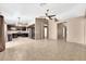 Open-concept living space with dark cabinetry and tile flooring at 7214 W Crest Ln, Glendale, AZ 85310