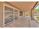 Covered patio with security screen door at 7214 W Crest Ln, Glendale, AZ 85310