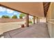 A covered patio with block wall fencing at 7214 W Crest Ln, Glendale, AZ 85310