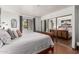 Bright bedroom features a king bed, mirrored closet and private window at 7777 E Main St # 143, Scottsdale, AZ 85251