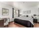 Bedroom with nice tile flooring, desk and bed features black and white theme at 7777 E Main St # 143, Scottsdale, AZ 85251
