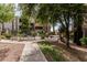 Beautifully landscaped community grounds with mature trees, hot tub, picnic area and wrought iron fencing at 7777 E Main St # 143, Scottsdale, AZ 85251