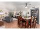 Open floorplan combines living and dining spaces, enhanced by a ceiling fan at 7777 E Main St # 143, Scottsdale, AZ 85251