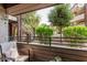 Relaxing condo patio view of meticulously landscaped grounds with mature trees and wrought iron staircase at 7777 E Main St # 143, Scottsdale, AZ 85251