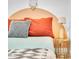 Close up shot of bright and cozy bedroom with unique gold side table and peach accents at 8614 E Rose Ln, Scottsdale, AZ 85250