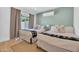 Charming bedroom with two twin beds, modern decor, and natural light from the window at 8614 E Rose Ln, Scottsdale, AZ 85250