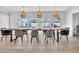 Bright dining room features a live-edge wood table and sliding doors to the backyard pool area at 8614 E Rose Ln, Scottsdale, AZ 85250