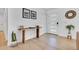 Modern entryway featuring wood floors, console table with stylish decor, and contemporary art that adds a touch of sophistication at 8614 E Rose Ln, Scottsdale, AZ 85250