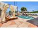Beautiful pool area features a covered lounge, spa, pizza oven and hammocks that create a perfect oasis for relaxation and enjoyment at 8614 E Rose Ln, Scottsdale, AZ 85250