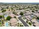 Expansive aerial view of a well-planned community with lush landscaping and neighborhood streets at 8738 W Runion Dr, Peoria, AZ 85382