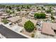 Overhead perspective of a well-placed home nestled in a friendly suburban community with mature trees at 8738 W Runion Dr, Peoria, AZ 85382