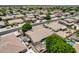Spacious suburban home with a landscaped backyard, pool, and covered patio, captured from above at 8738 W Runion Dr, Peoria, AZ 85382