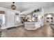 Inviting entryway with wood floors leading to an office space and living area at 8738 W Runion Dr, Peoria, AZ 85382