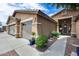 Charming single-Gathering home featuring a well-maintained front yard and a two-car garage at 8738 W Runion Dr, Peoria, AZ 85382