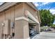 Garage corner showcasing neutral stucco siding, modern outdoor lighting, and extra street parking at 8738 W Runion Dr, Peoria, AZ 85382