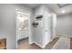 Hallway view of bathroom, doors, and decor, creating a welcoming, functional home space at 8738 W Runion Dr, Peoria, AZ 85382
