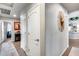 Hallway with neutral wall and flooring, doors, and art piece, creating a modern look at 8738 W Runion Dr, Peoria, AZ 85382