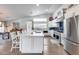 Bright kitchen featuring a large center island, stainless appliances, and abundant counter space at 8738 W Runion Dr, Peoria, AZ 85382